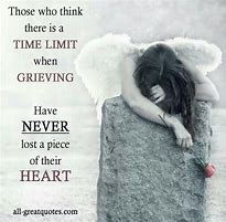 Angel drapped over a grave with a grief quote